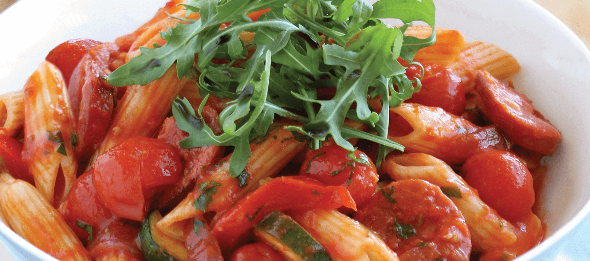 Penne with chorizo, zucchini & cherry tomatoes