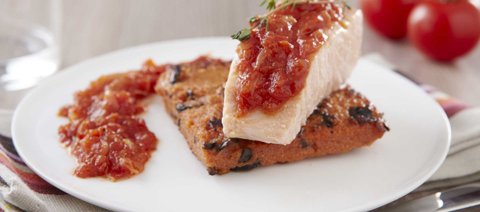 Salmon with thyme confit, crispy polenta and chopped tomatoes with basil and onion