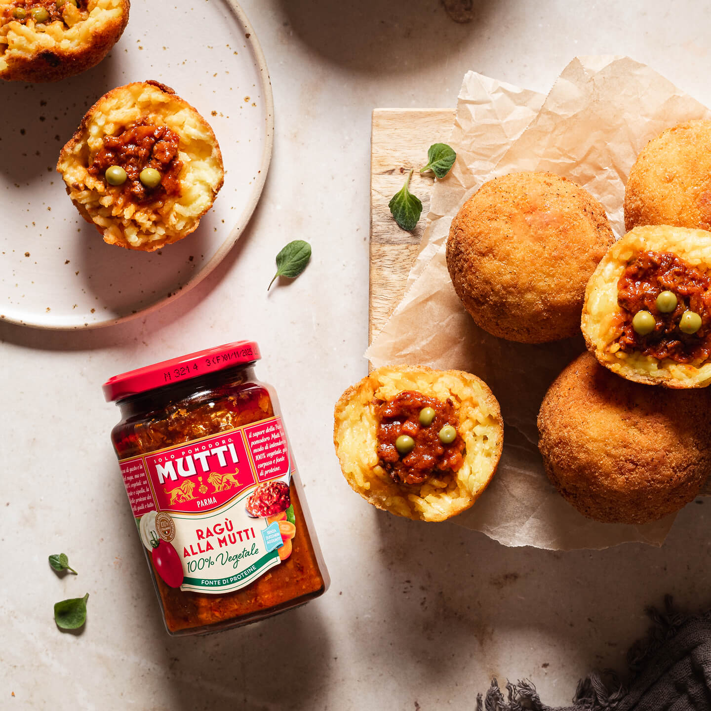 Mutti Ragu jar beside rice balls filled with tomato ragu