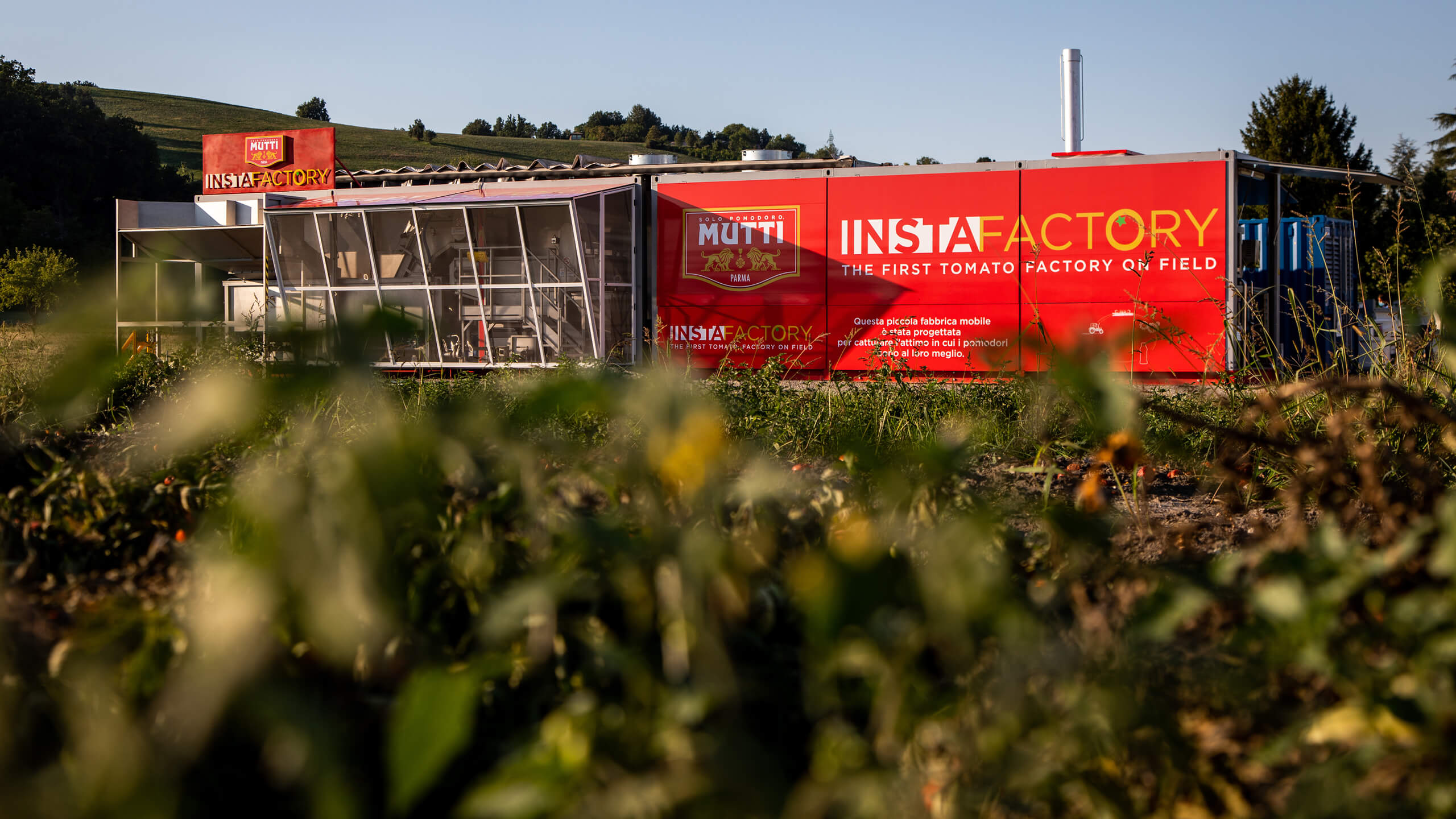 Mutti Instafactory mobile tomato processing unit parked in a field