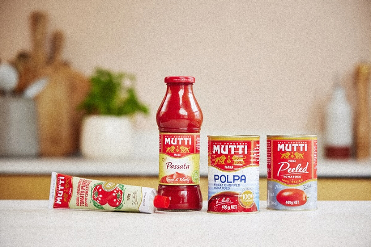 Mutti Passata, Polpa, Peeled Tomatoes and tomato paste on a counter