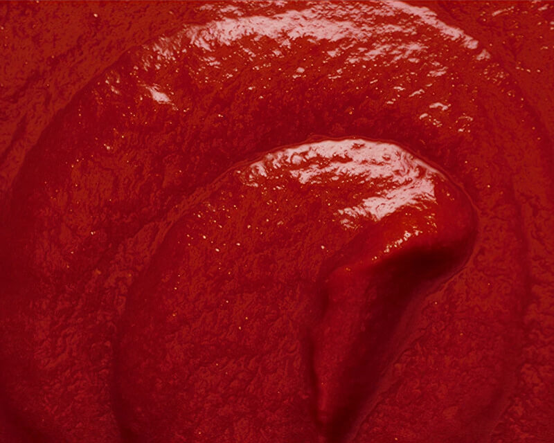 Glossy swirl of thick Mutti tomato purée