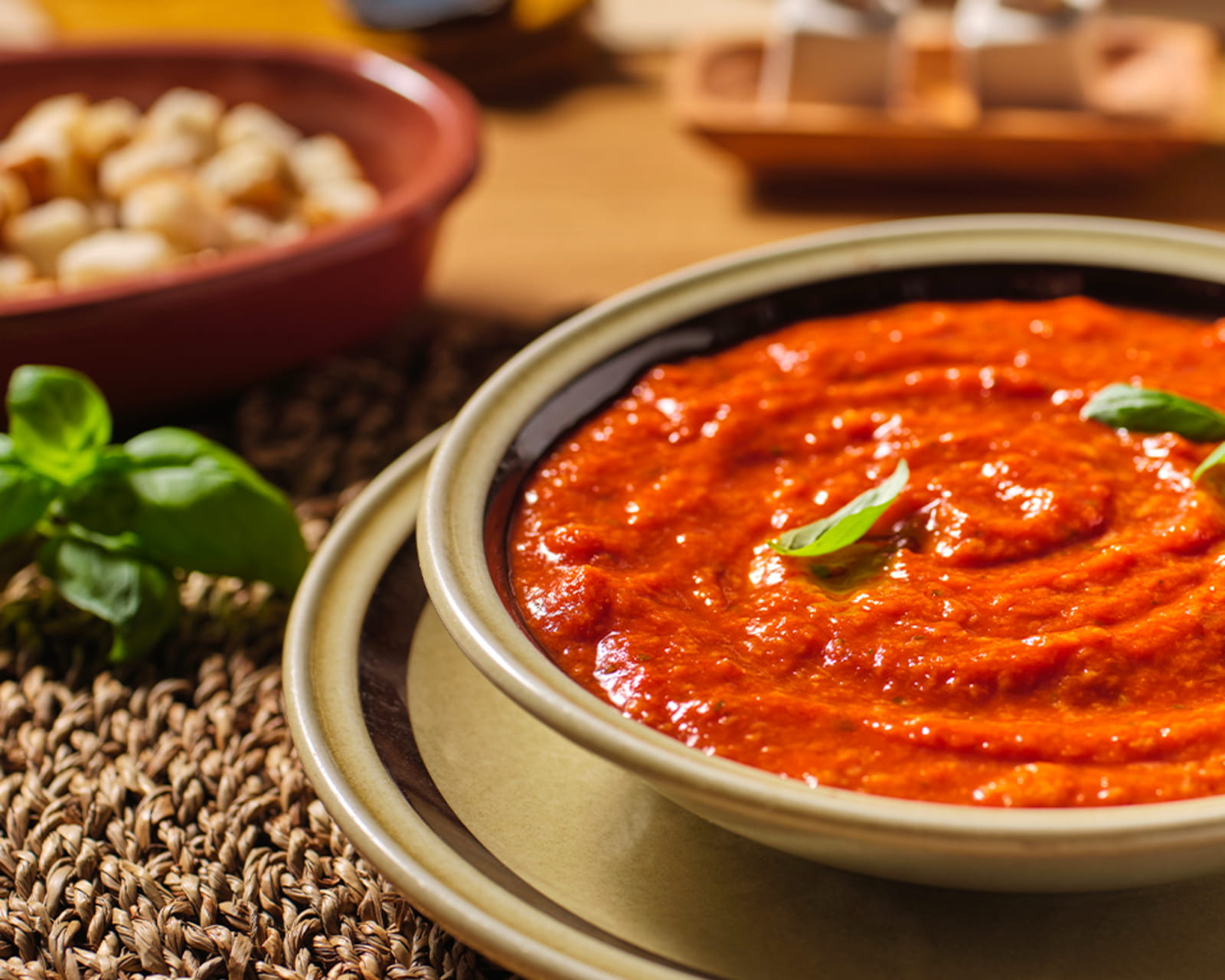 Bowl of pappa al pomodoro tomato and bread soup with basil