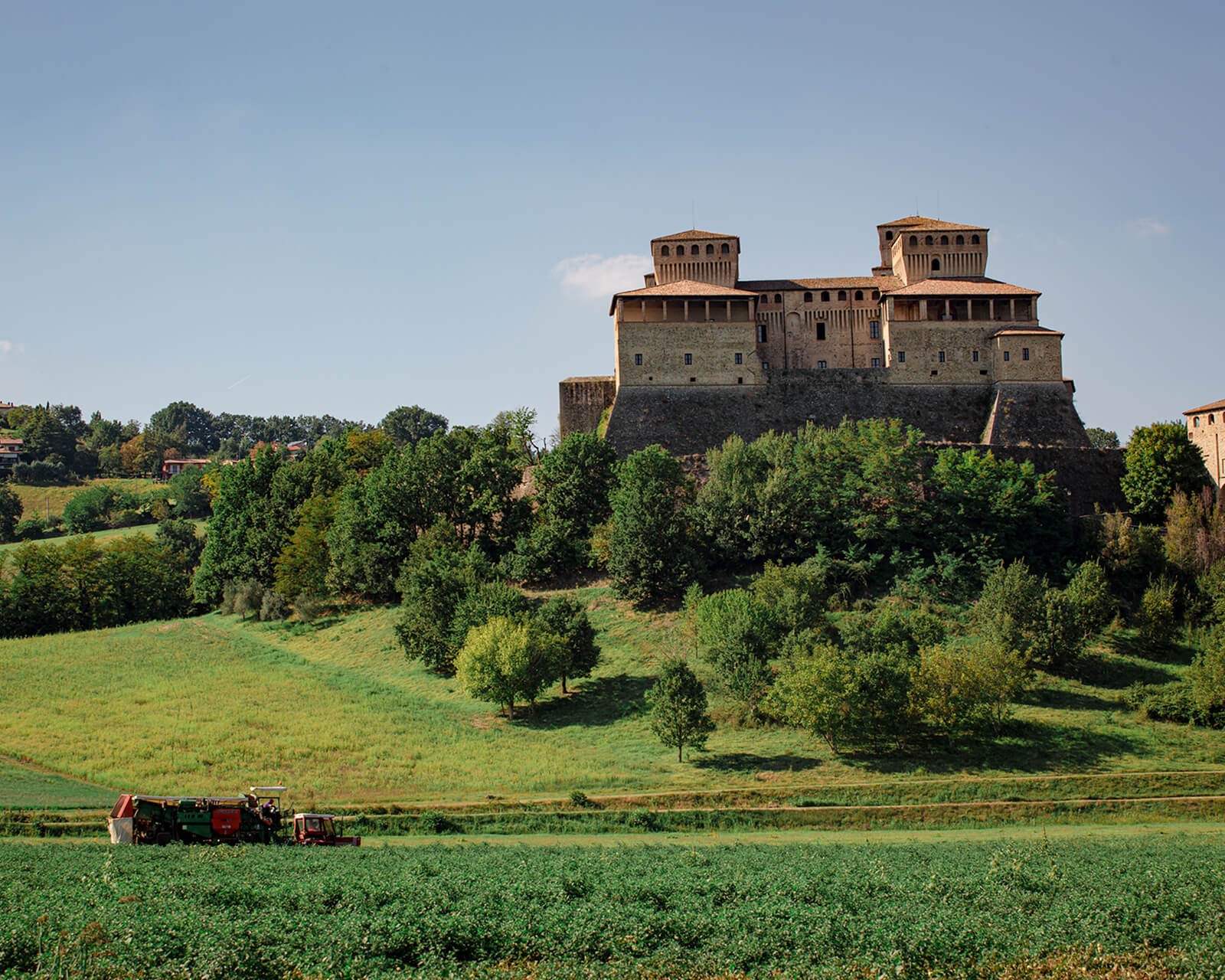 Hilltop castle and green fields in the Po Valley, Emilia-Romagna