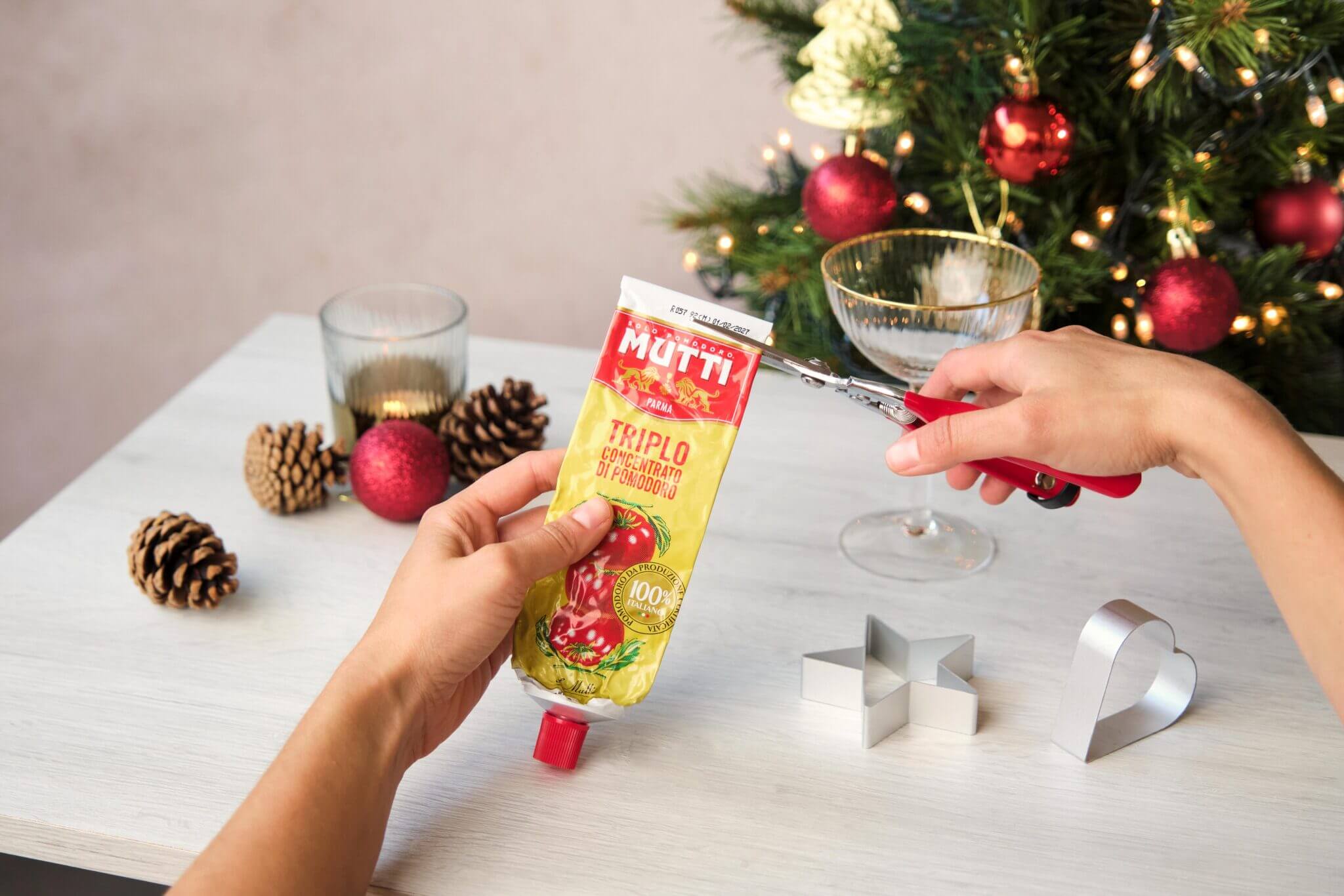 Cutting the cap off a Mutti Triple Concentrated Tomato Paste tube