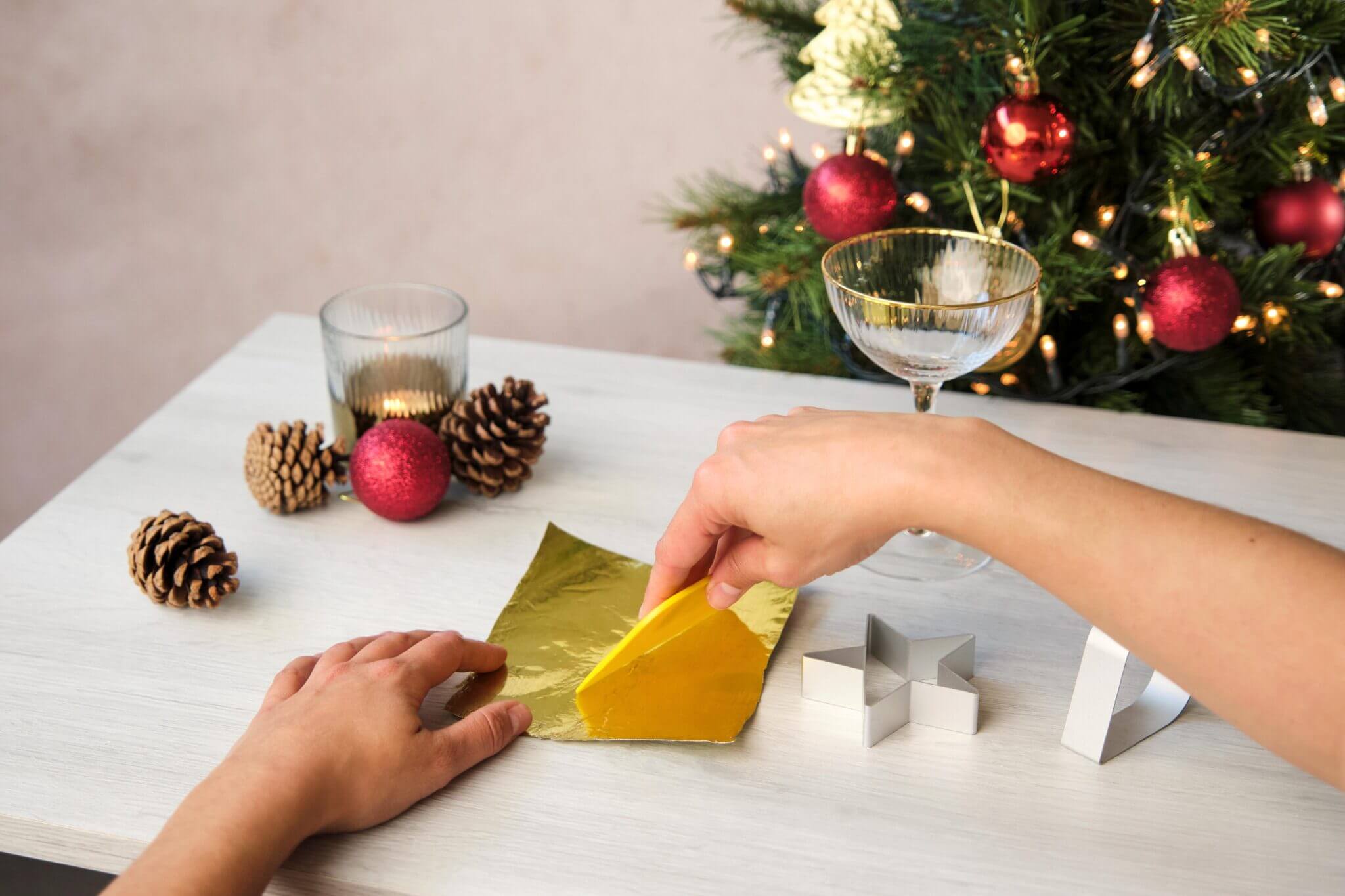 Peeling open a Mutti tomato paste tube to reveal gold foil