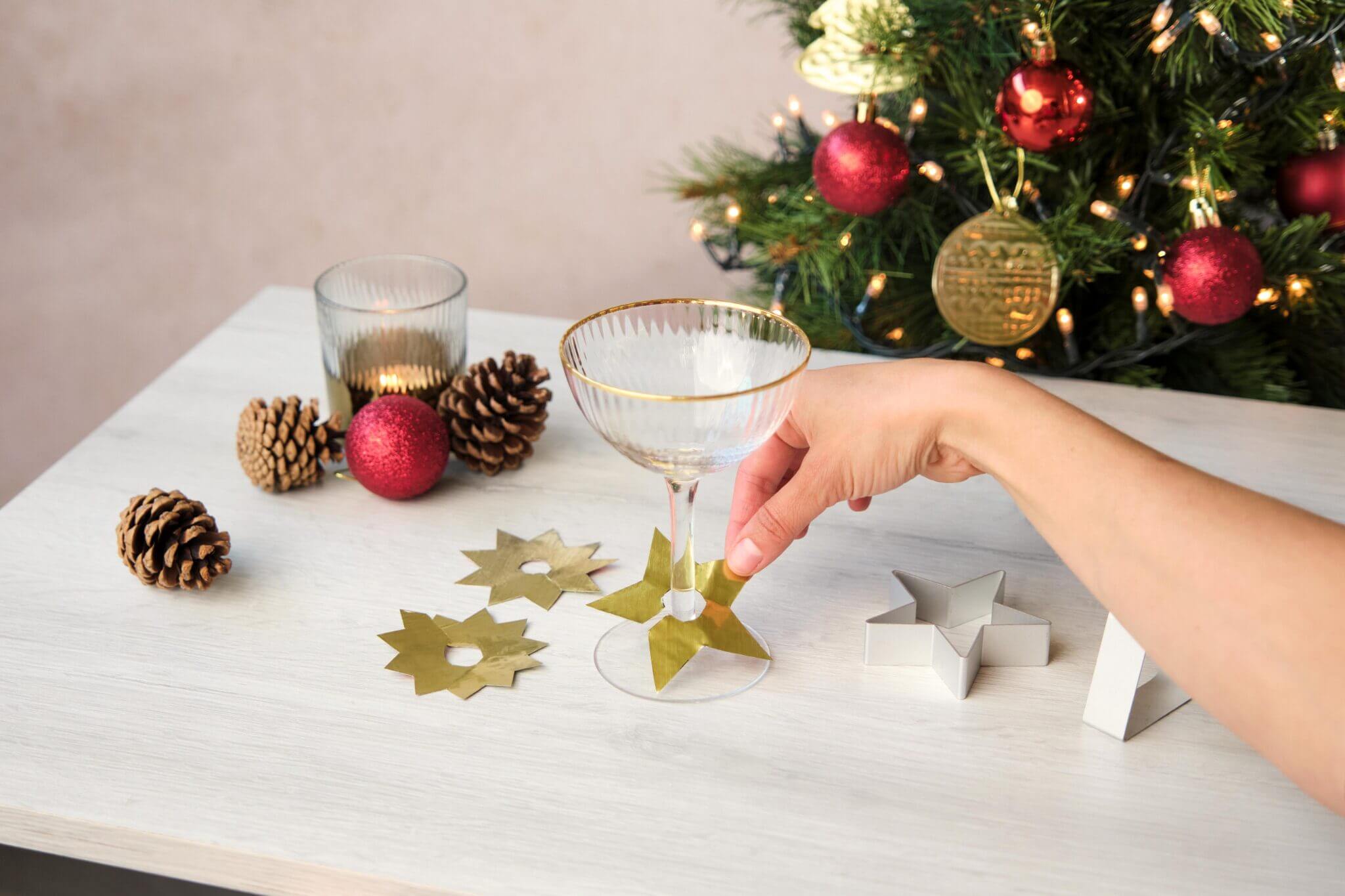 Cutting a star shape out of gold foil with scissors