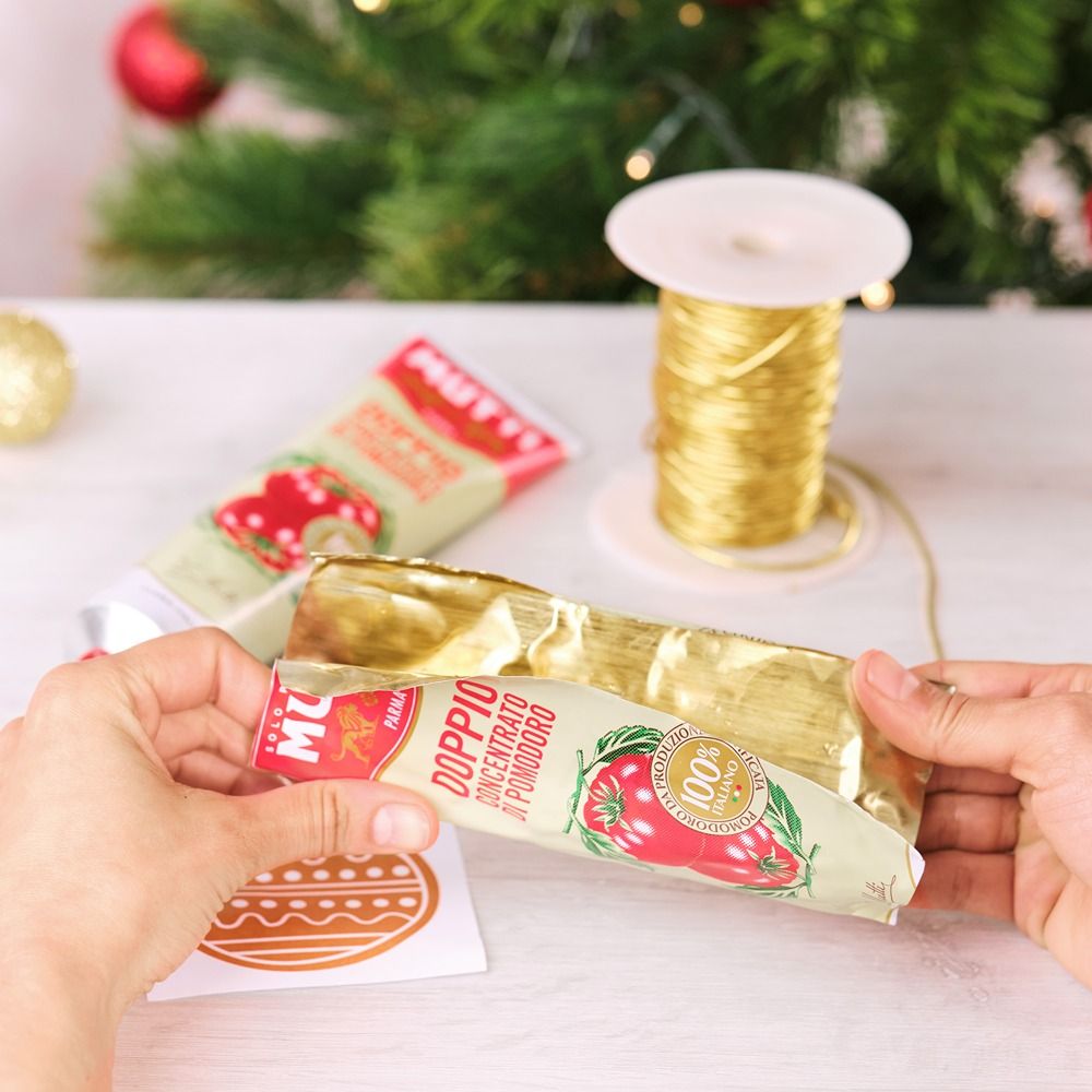 Opening a Mutti tomato paste tube along its seam