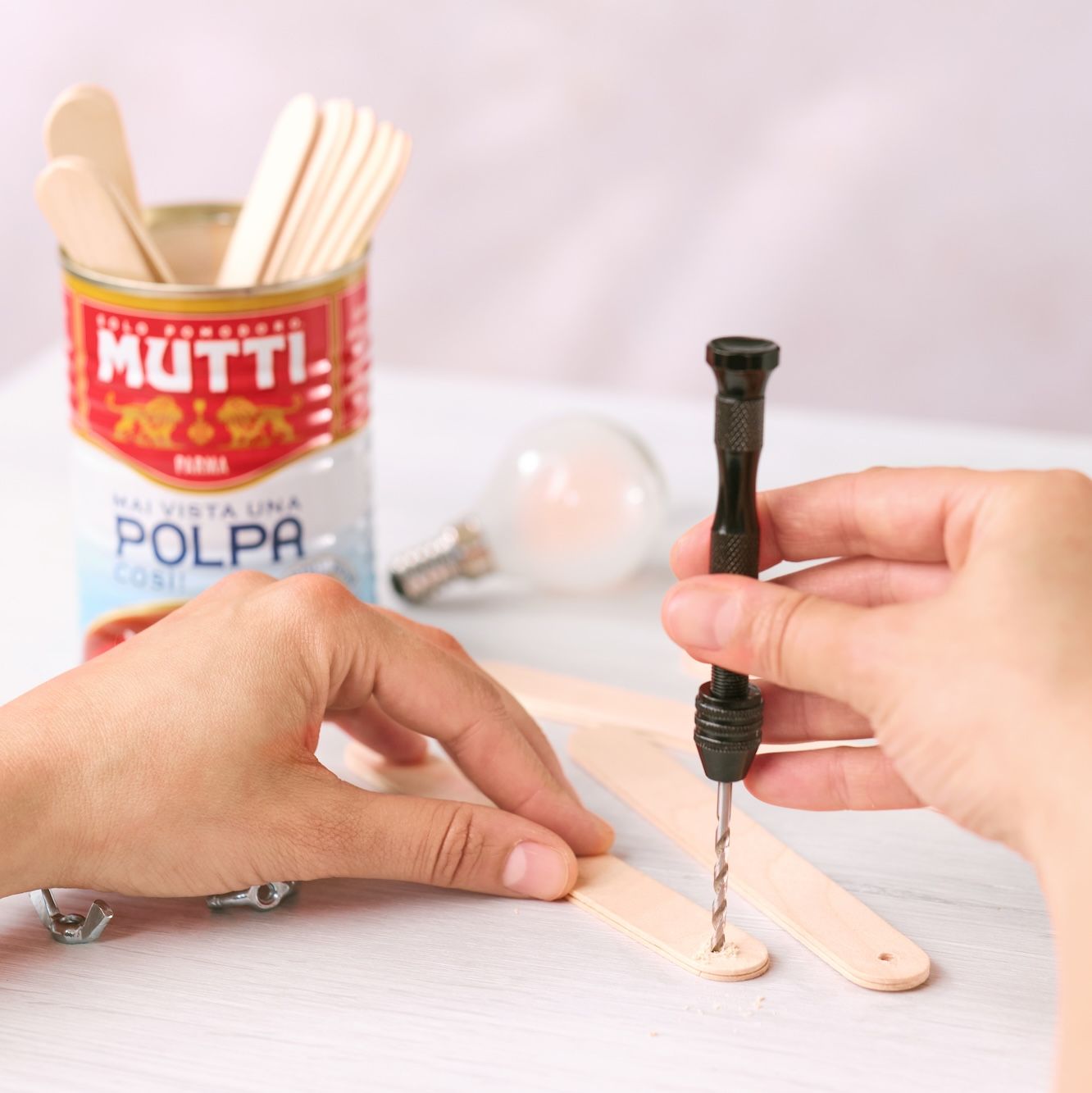Drilling holes in the ends of wooden craft sticks