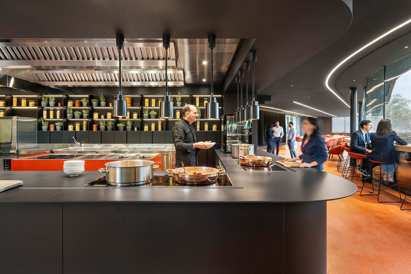 Open kitchen and dining area at a restaurant event in Lyon