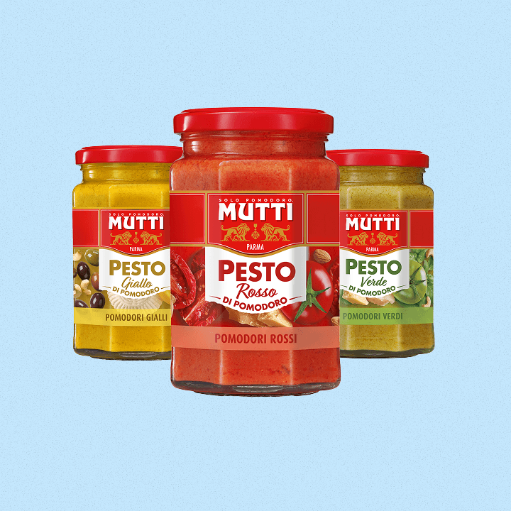 Three jars of Mutti pesto di pomodoro in yellow, red and green