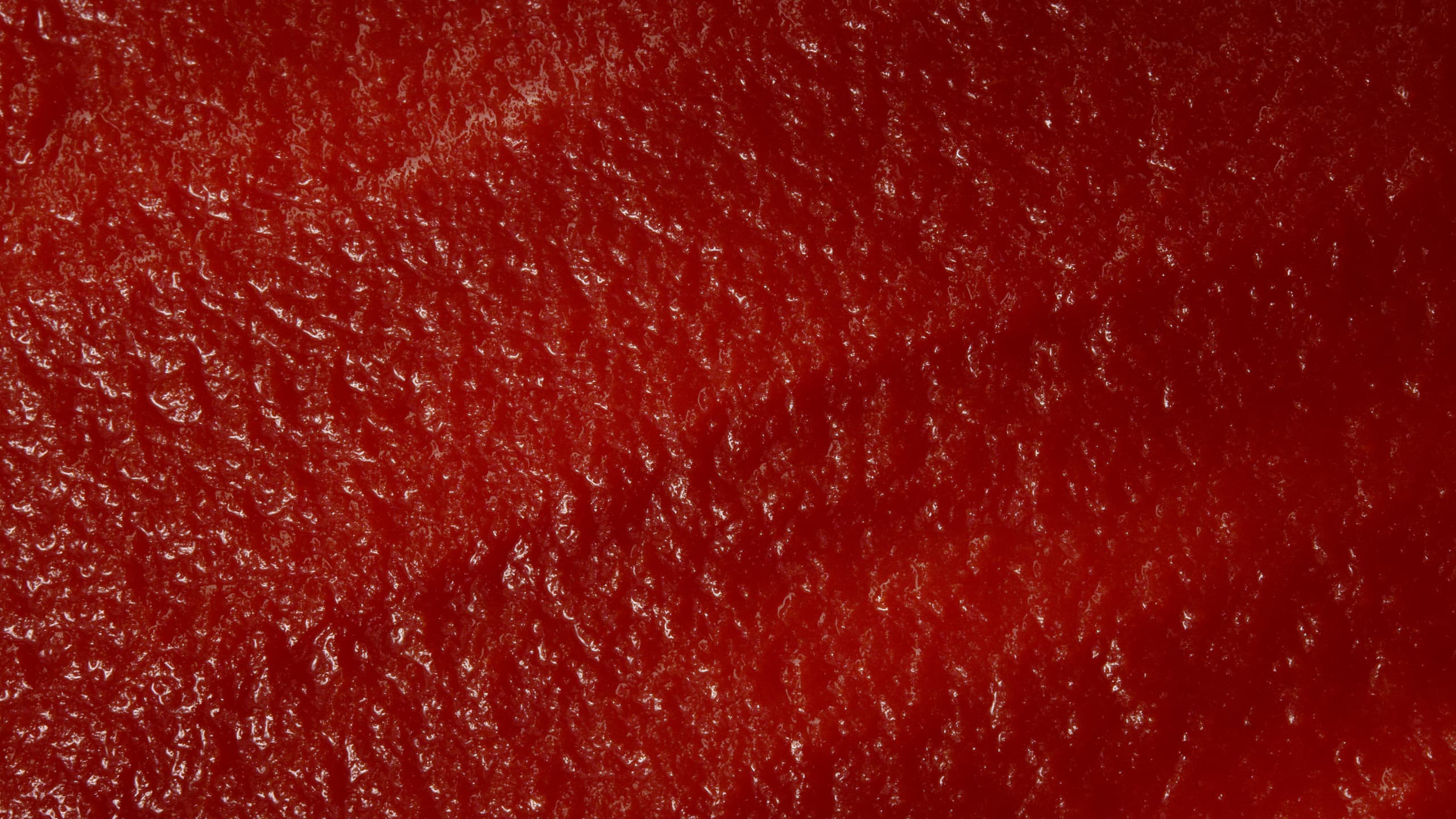Close-up smooth texture of Mutti ketchup