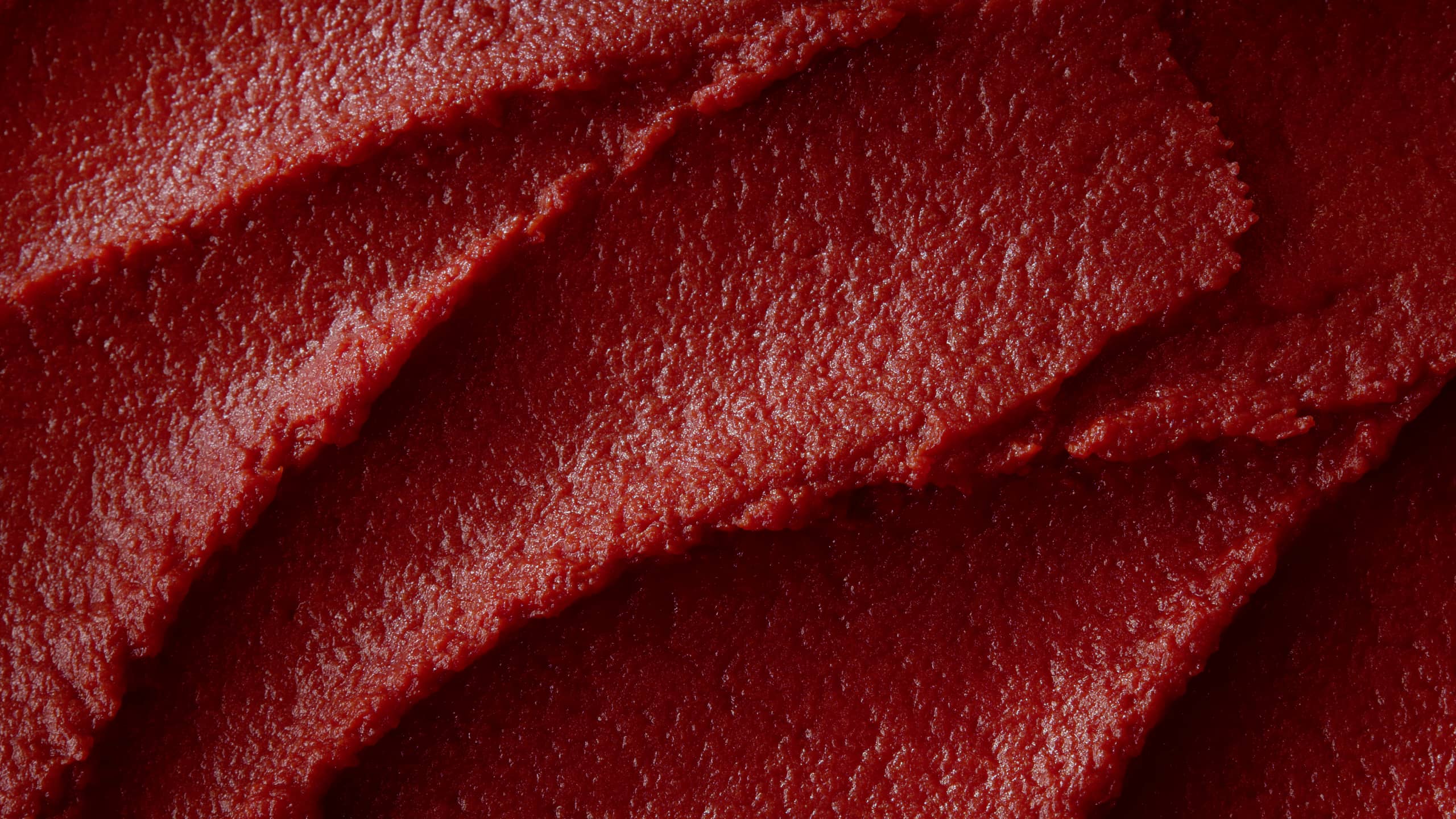Close-up texture of thick double concentrated tomato paste