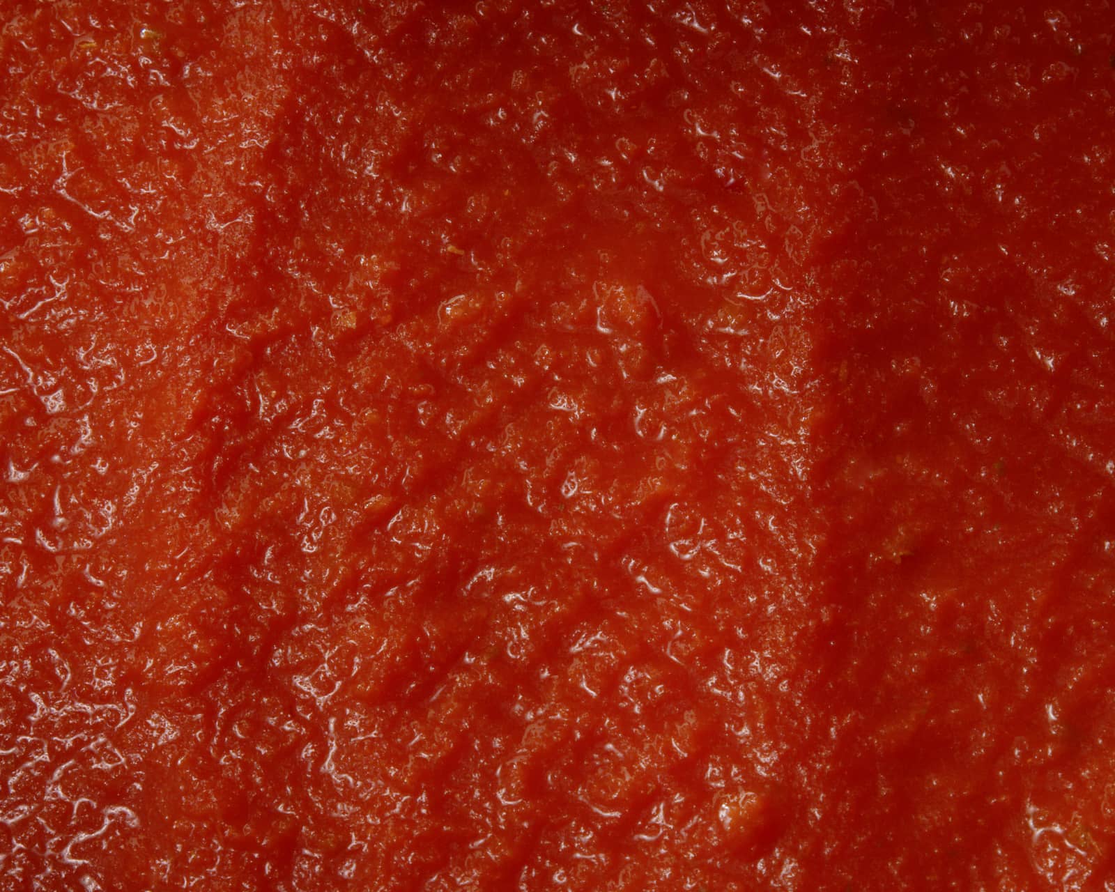 Close-up texture of smooth ready-to-use tomato sauce