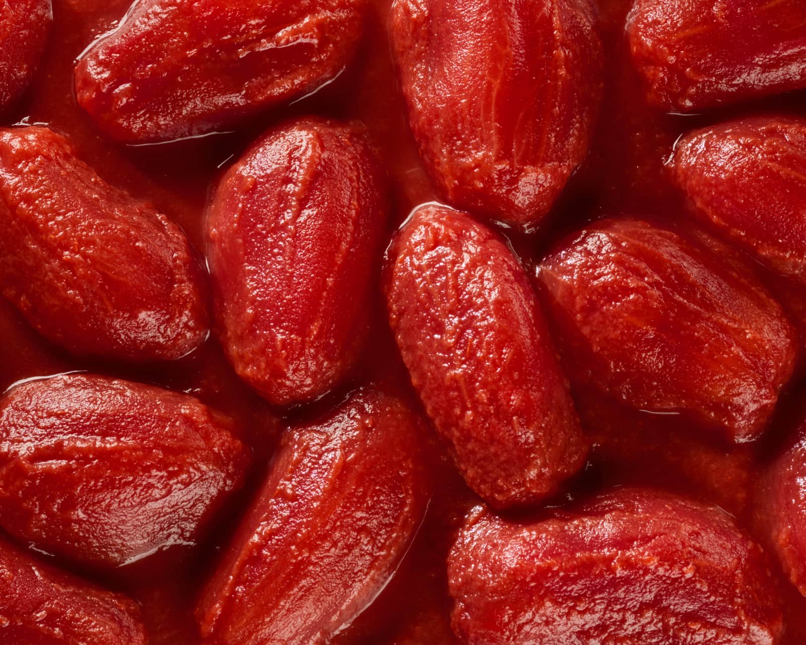 Close-up of whole Mutti peeled tomatoes in their juice