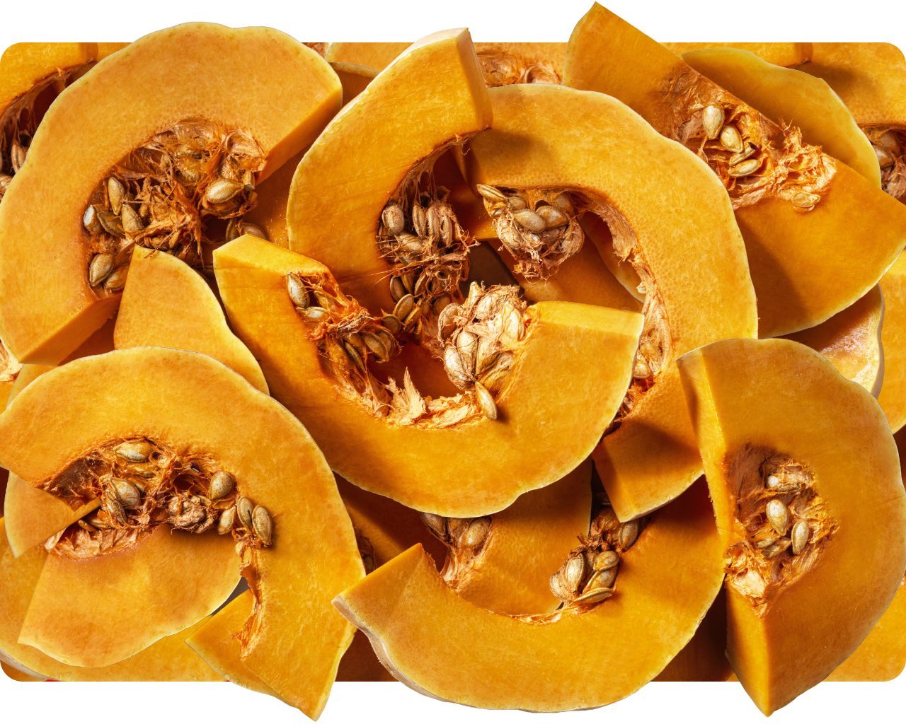 Sliced fresh pumpkin with seeds and flesh exposed